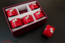 Set of 6 red napkin rings attached with butterfly